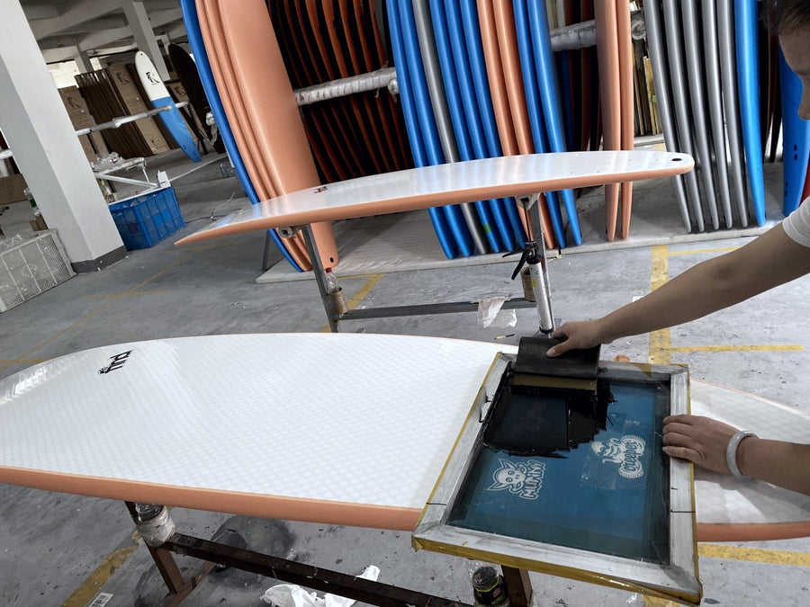 Screen printing a graphic onto a board deck