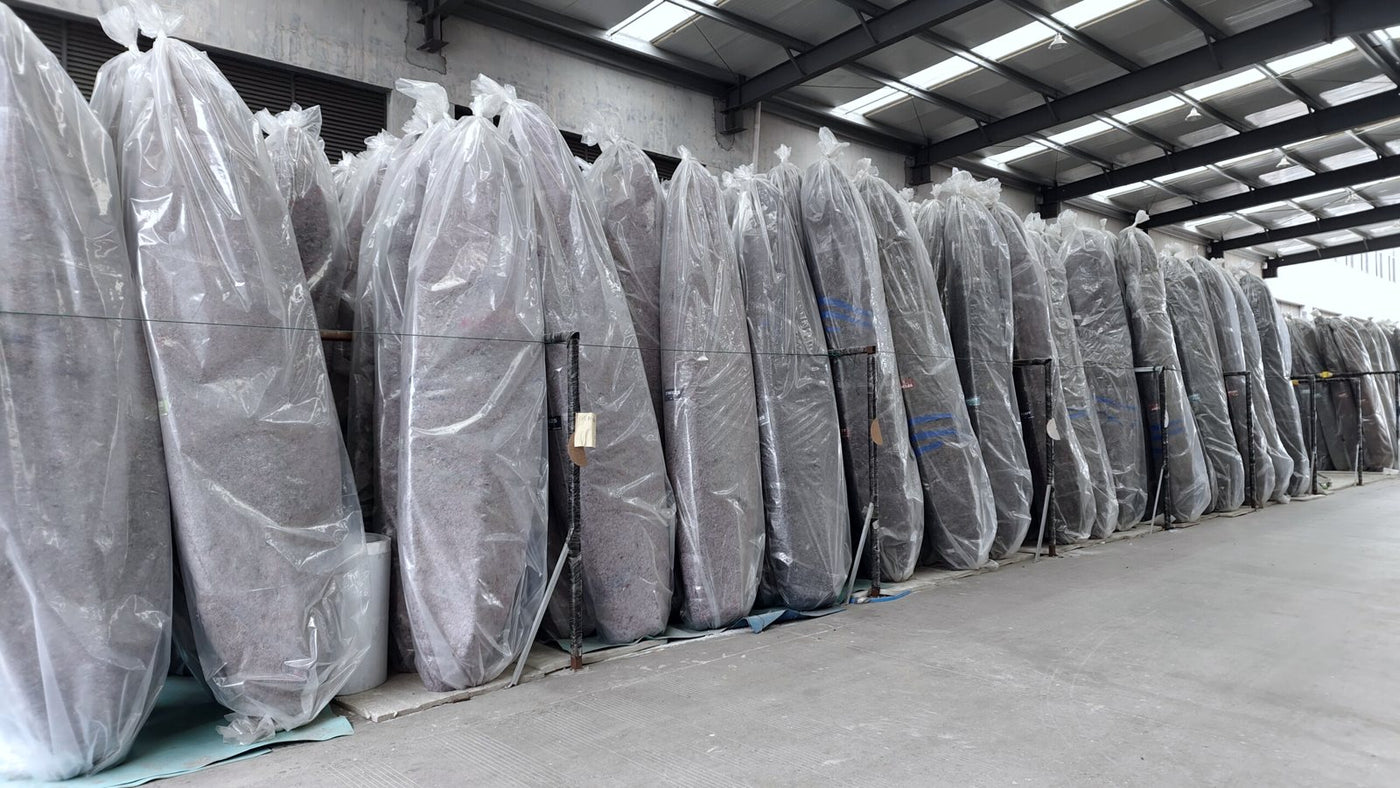 Packed kayaks lined up in the warehouse, ready to ship